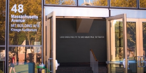 Left entrance of the building, looking at the left naming.
