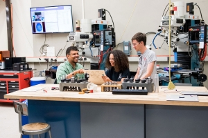 MIT Maker Czar and mechanical engineering professor Martin Culpepper works with students