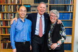 Patricia (right) and James Poitras ’63 (center) with Guoping Feng, the the James W. (1963) and Patricia T. Poitras Professor of Brain and Cognitive Sciences at MIT.