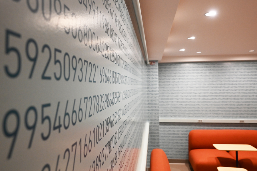 Close up photo wallpaper adorned with digits of pi in a student lounge