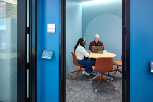 A student meets with her advisor in one of the advising spaces at the new UAC.